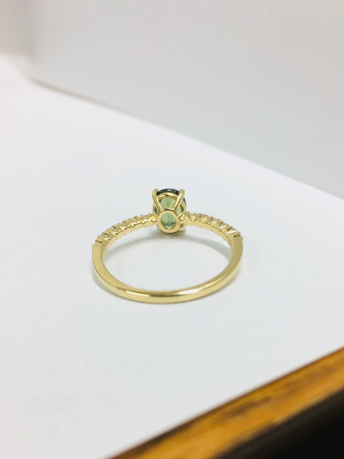 0.80ct / 0.12ct green sapphire and diamond dress ring. Oval cut ( treated ) sapphire with small - Image 3 of 4