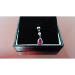0.35ct ruby and diamond drop style pendant ( no chain ).Pear shaped ruby ( glass filled ) 0.35ct