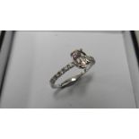 0.80ct / 0.12ct morganite and diamond dress ring. Oval cut ( treated ) morganite with small diamonds