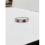 0.75ct ruby and diamond five stone ringset in 18ct gold. 2 rubies( treated ) 3 brilliant cut