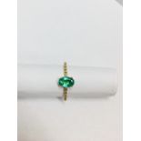 0.80ct / 0.12ct Emerald and diamond dress ring. Oval cut ( oil treated) emerald with small