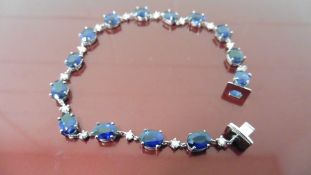 11ct sapphire and diamond bracelet.Set with oval ( treated ) sapphires and small brilliant cut