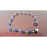 11ct sapphire and diamond bracelet.Set with oval ( treated ) sapphires and small brilliant cut