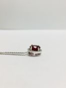 2.40ct halo set diamond pendant. Oval cut ruby ( glass filled ) in the centre, 2.40ct, with a halo