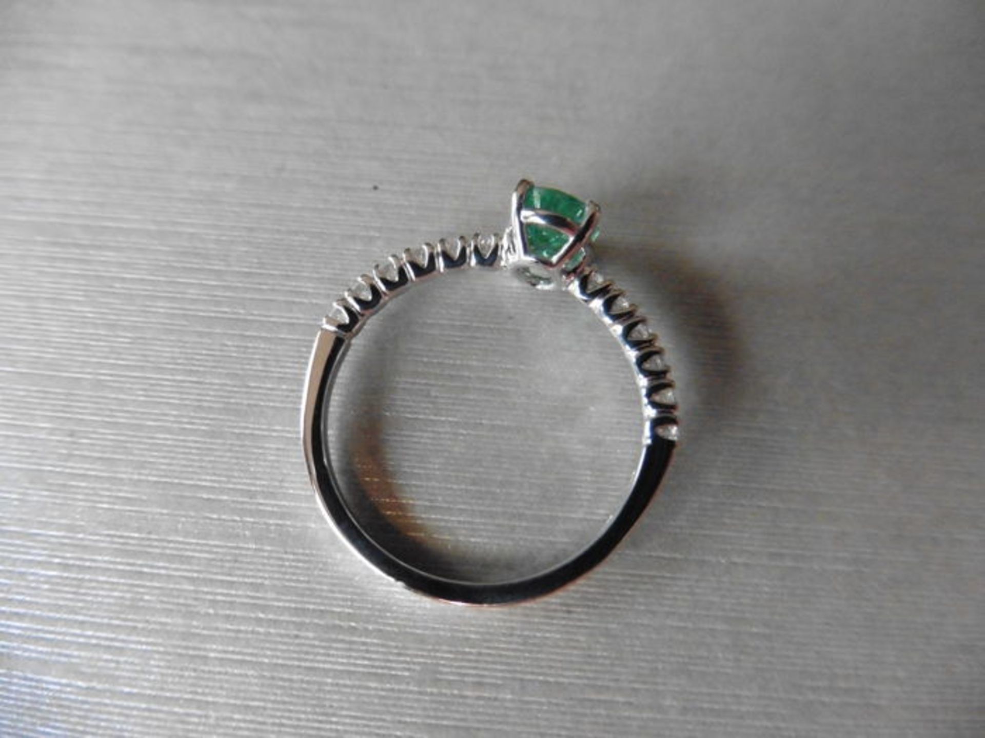 0.80ct / 0.12ct Emerald and diamond dress ring. Oval cut ( oil treated) emerald with small - Image 2 of 3