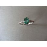 0.80ct / 0.12ct Emerald and diamond dress ring. Oval cut ( oil treated) emerald with small