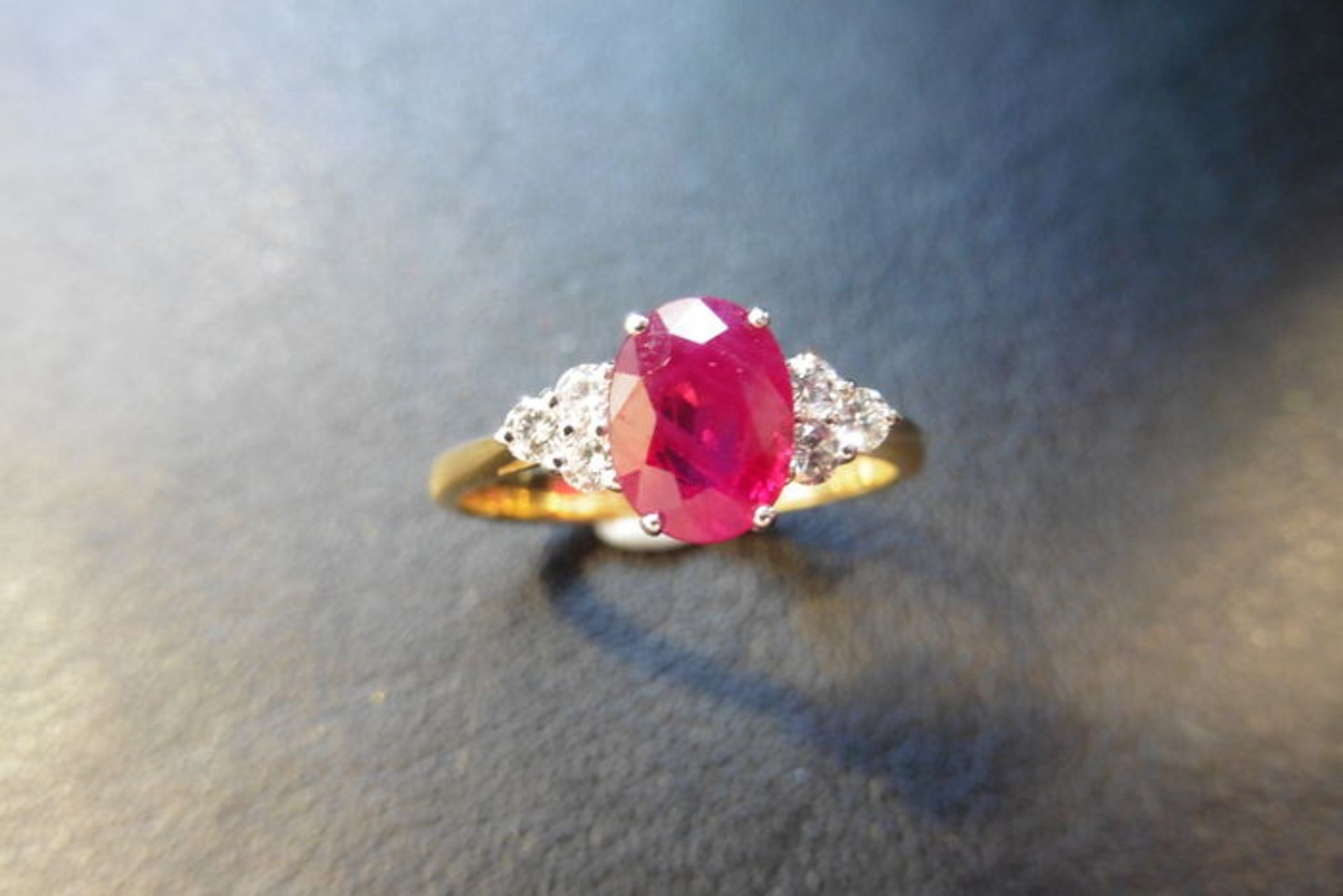 0.80ct ruby and diamond dress ring. 7x 5mm oval cutr uby (treated) with 3 small diamonds set - Image 3 of 3