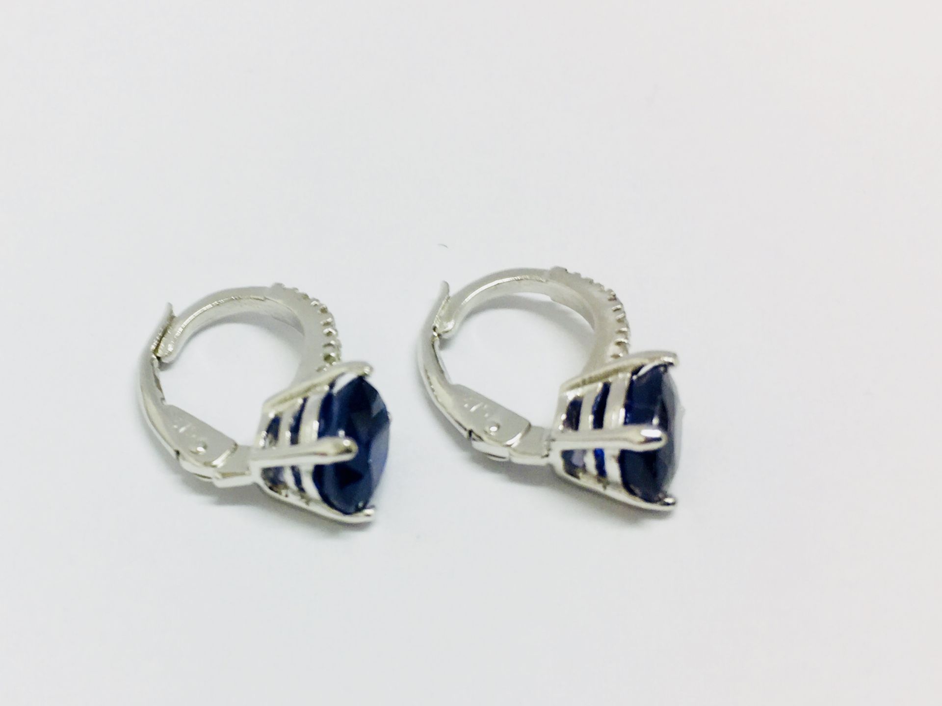 1.60ct sapphire and diamond hoop style earrings. Each is set with a 7x 5mm oval cut sapphire ( - Image 3 of 4
