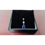 0.35ct sapphire and diamond drop style pendant ( no chain ).Pear shaped sapphire ( glass filled )