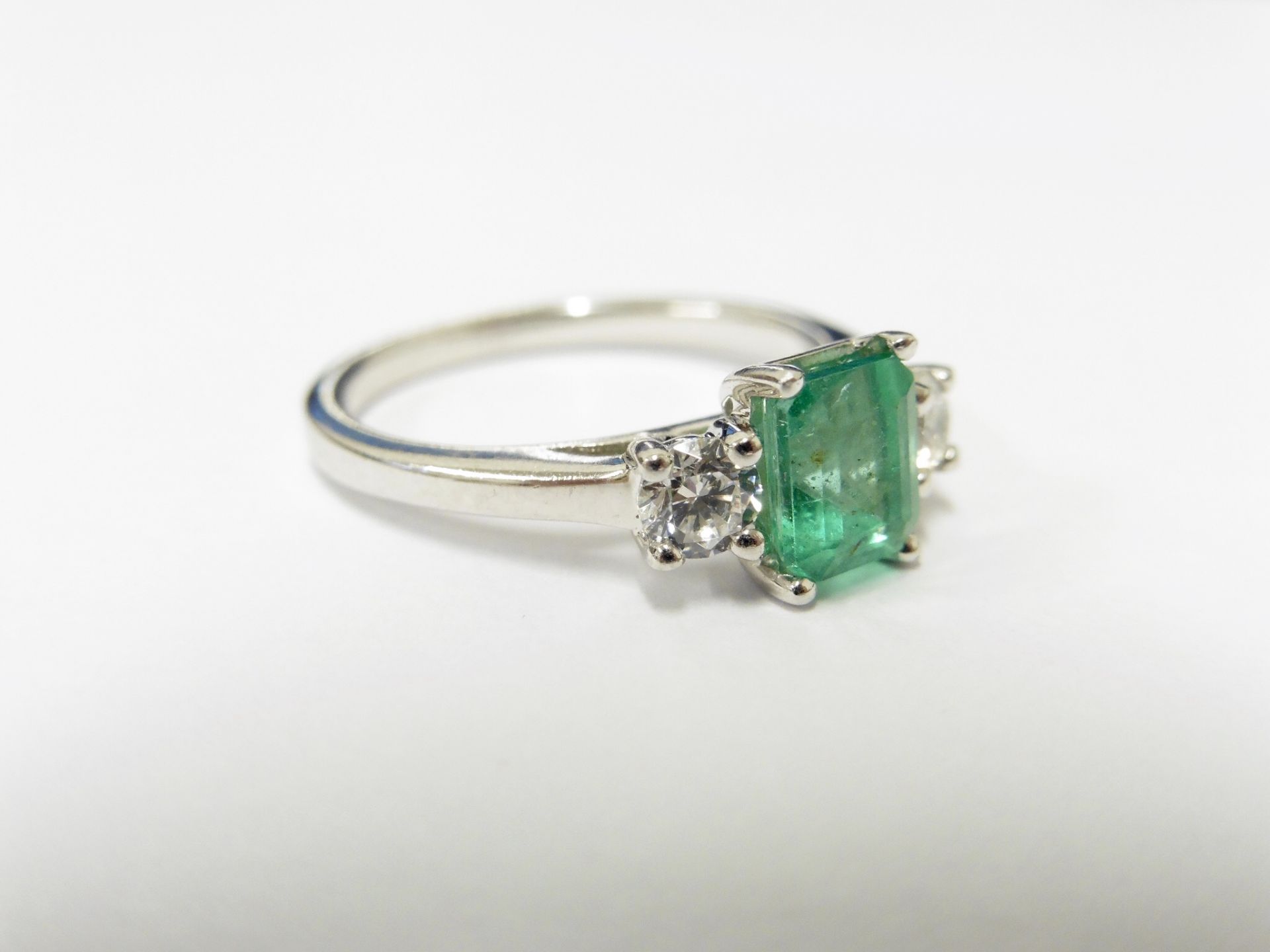 Platinum Emerald diamond trilogy ring,7mmx5mm 1ct natural emerald,0.20ct diamonds(2x0.10ct) si2 - Image 2 of 5