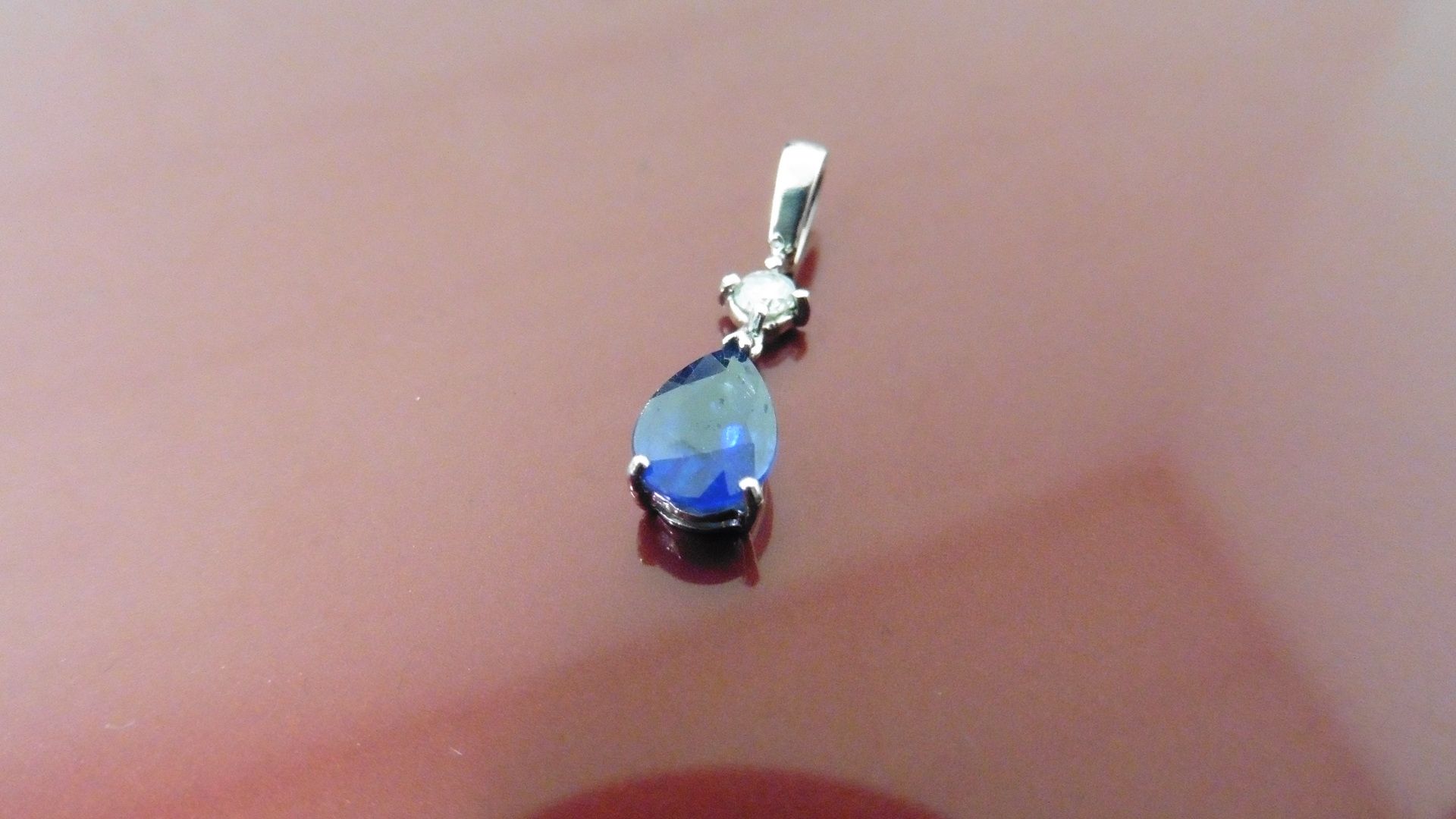0.35ct sapphire and diamond drop style pendant ( no chain ).Pear shaped sapphire ( glass filled ) - Image 2 of 3