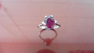 2.40ct Ruby and diamond dress ring. Oval cut ( glass filled ) ruby with a small brilliant cut