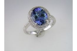 A "Fully Restored" Tanzanite and Diamond Cluster Ring