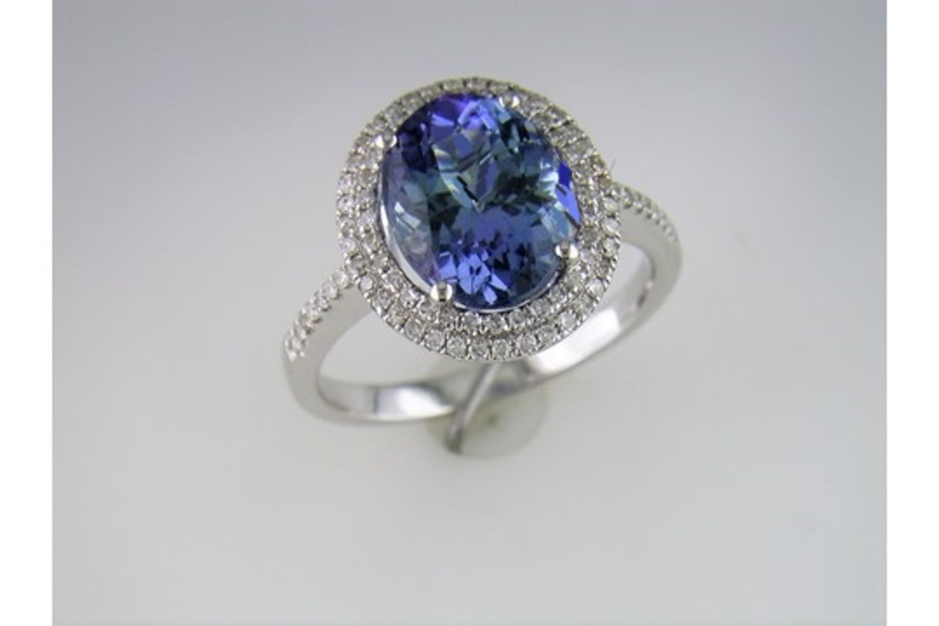 A "Fully Restored" Tanzanite and Diamond Cluster Ring