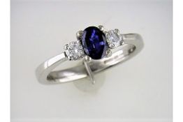A "Restored" Three Stone Sapphire and Diamond Ring