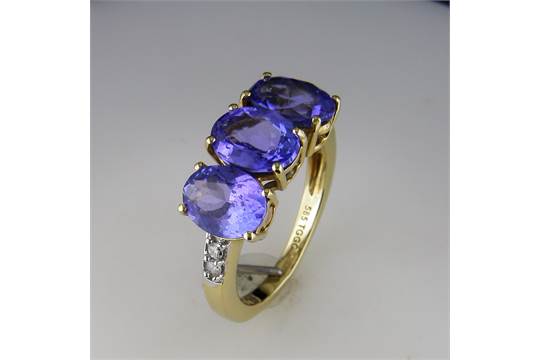 A "Fully Restored " Oval Tanzanite Trilogy and Diamond Ring