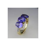A "Fully Restored " Oval Tanzanite Trilogy and Diamond Ring