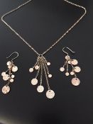 Silver pendant and matching earrings
