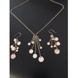 Silver pendant and matching earrings