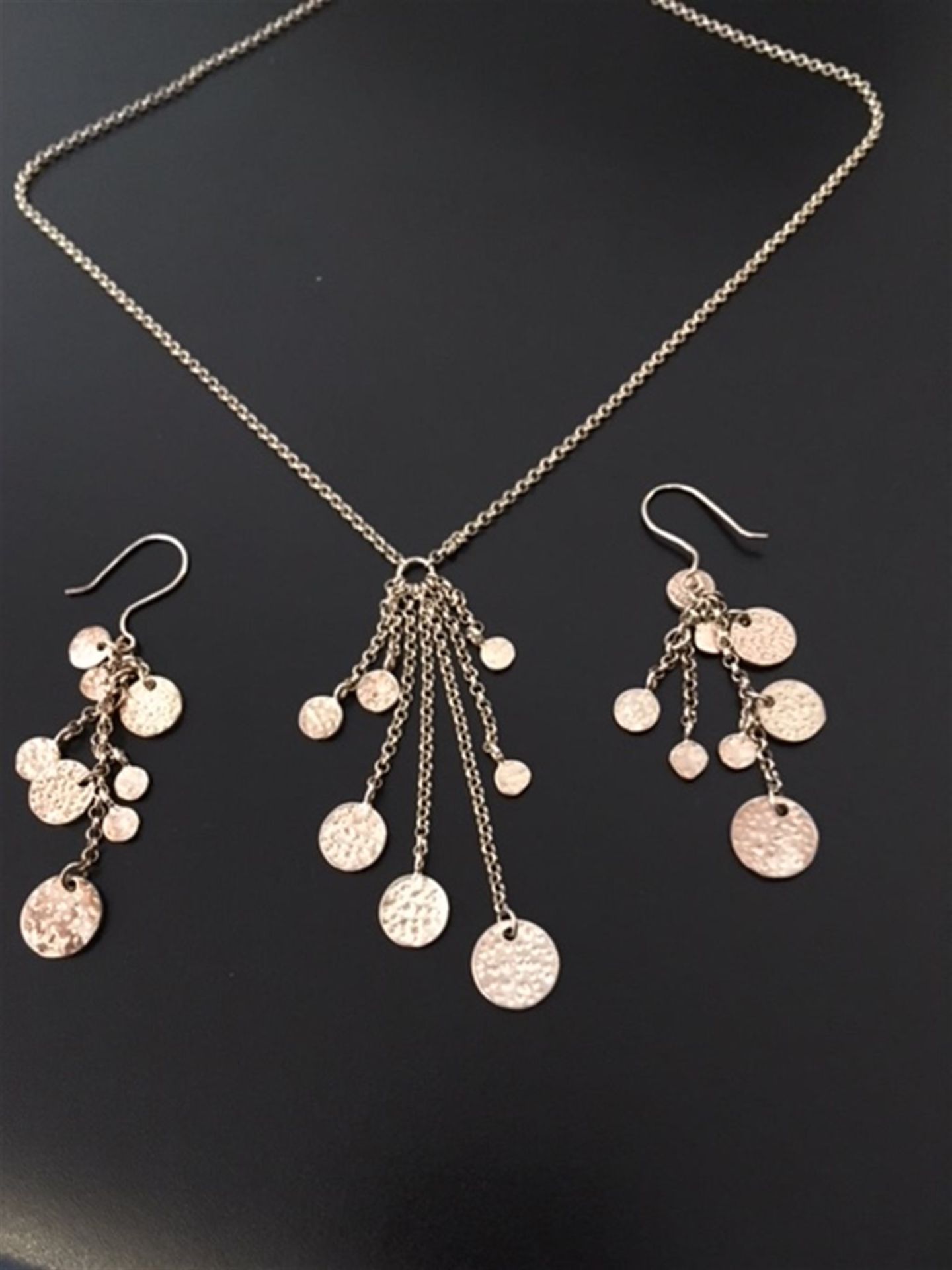 Silver pendant and matching earrings