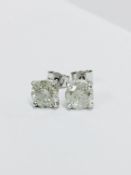 2.50ct Solitaire diamond stud earrings set with brilliant cut diamonds which have been enhanced. I