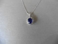 0.80ct sapphire and diamond cluster style pendant. ÊOval cut ( glass filled ) sapphire with 12 small