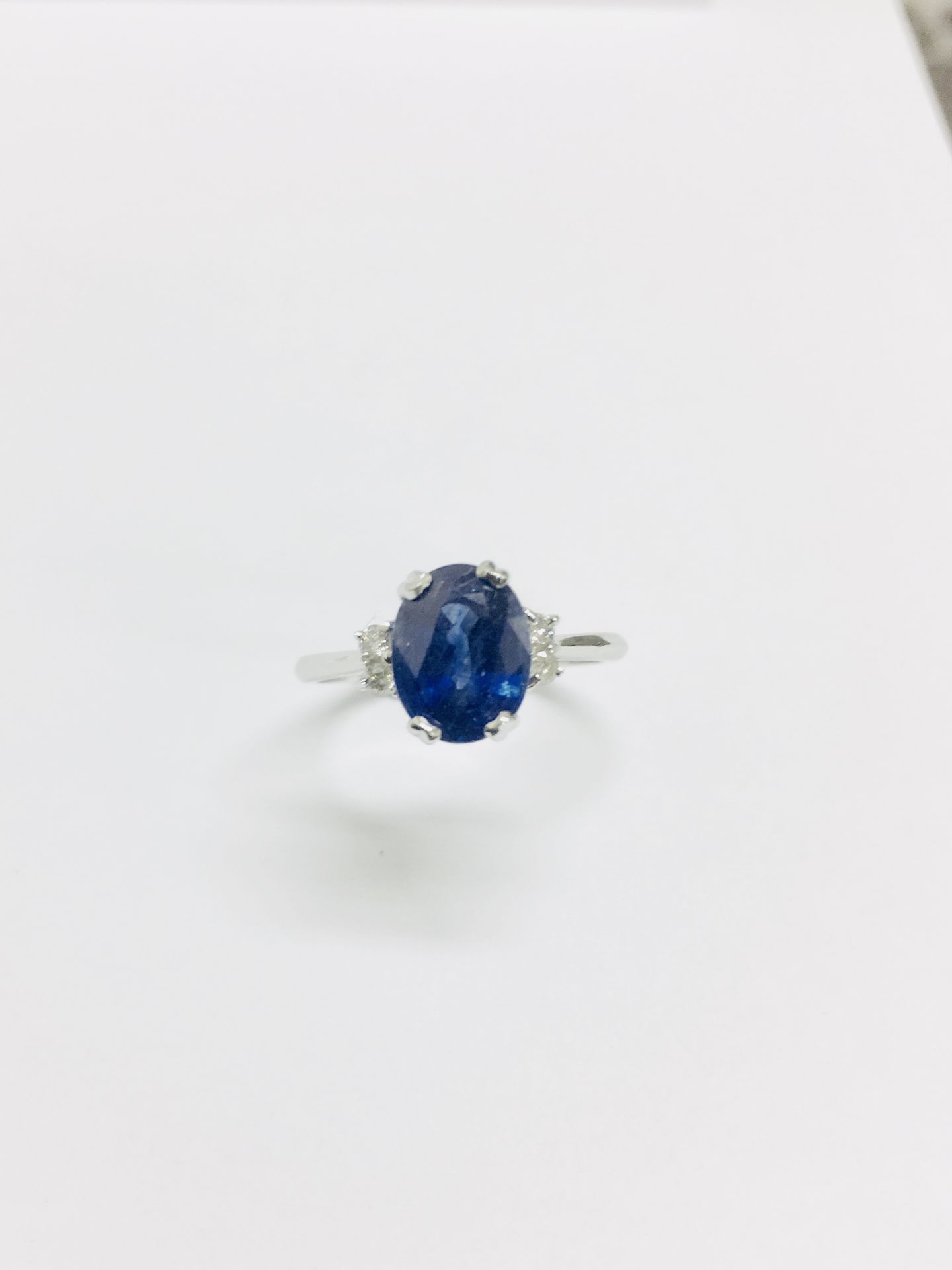 2.40ct sapphire and diamond ring. Oval cut ( glass filled ) sapphire with 2 small brilliant cut - Image 4 of 5