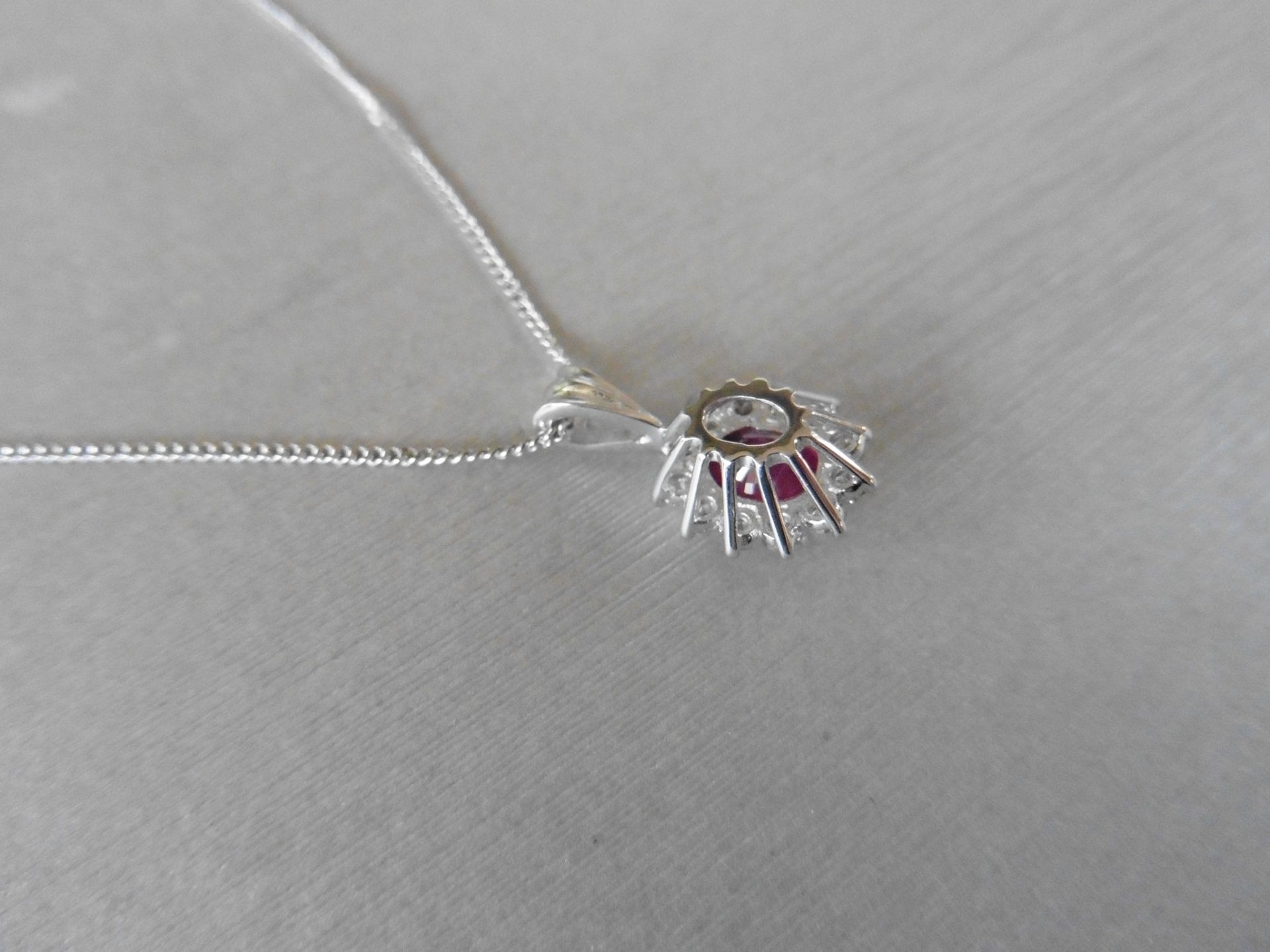 0.80ct ruby and diamond cluster style pendant. ÊOval cut ( glass filled ) treated ruby with 12 small - Image 3 of 3