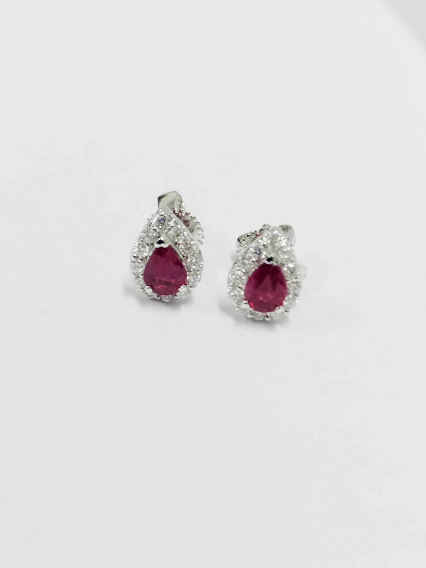 18ct white gold Ruby & Diamond Earrings,Ruby 0.58ct pearshape natural,0.17ct diamond brilliant cut g