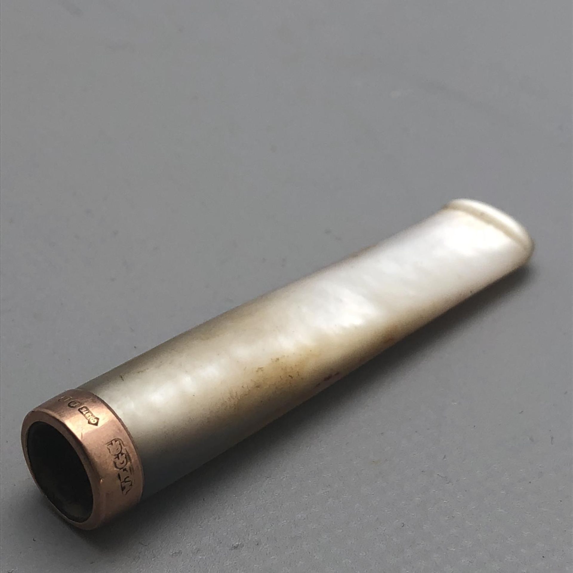 An Art Deco Mother of Pearl and 9ct Rose Gold Cheroot Holder