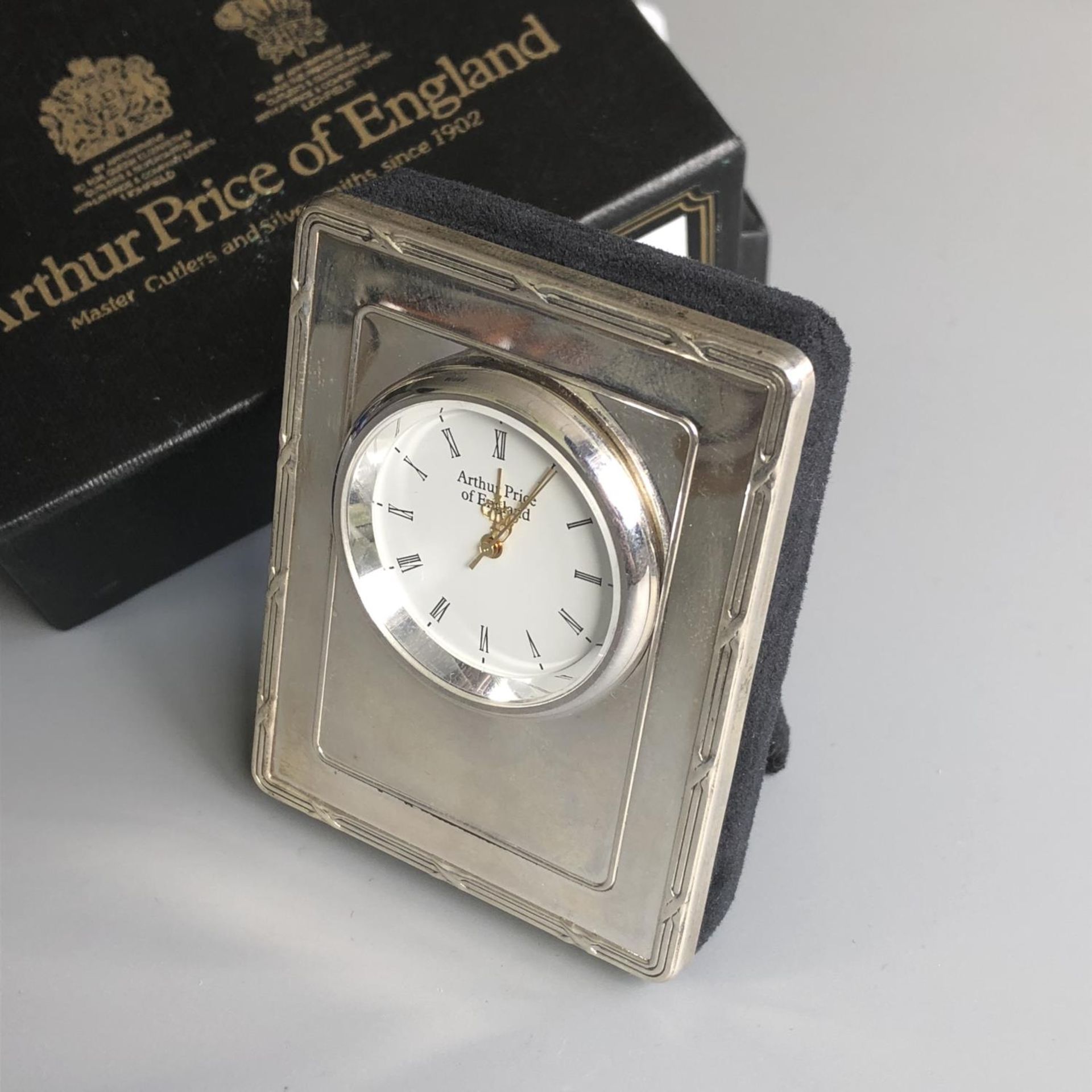 A silver clock by Arthur Price, together with original box - hallmarked London