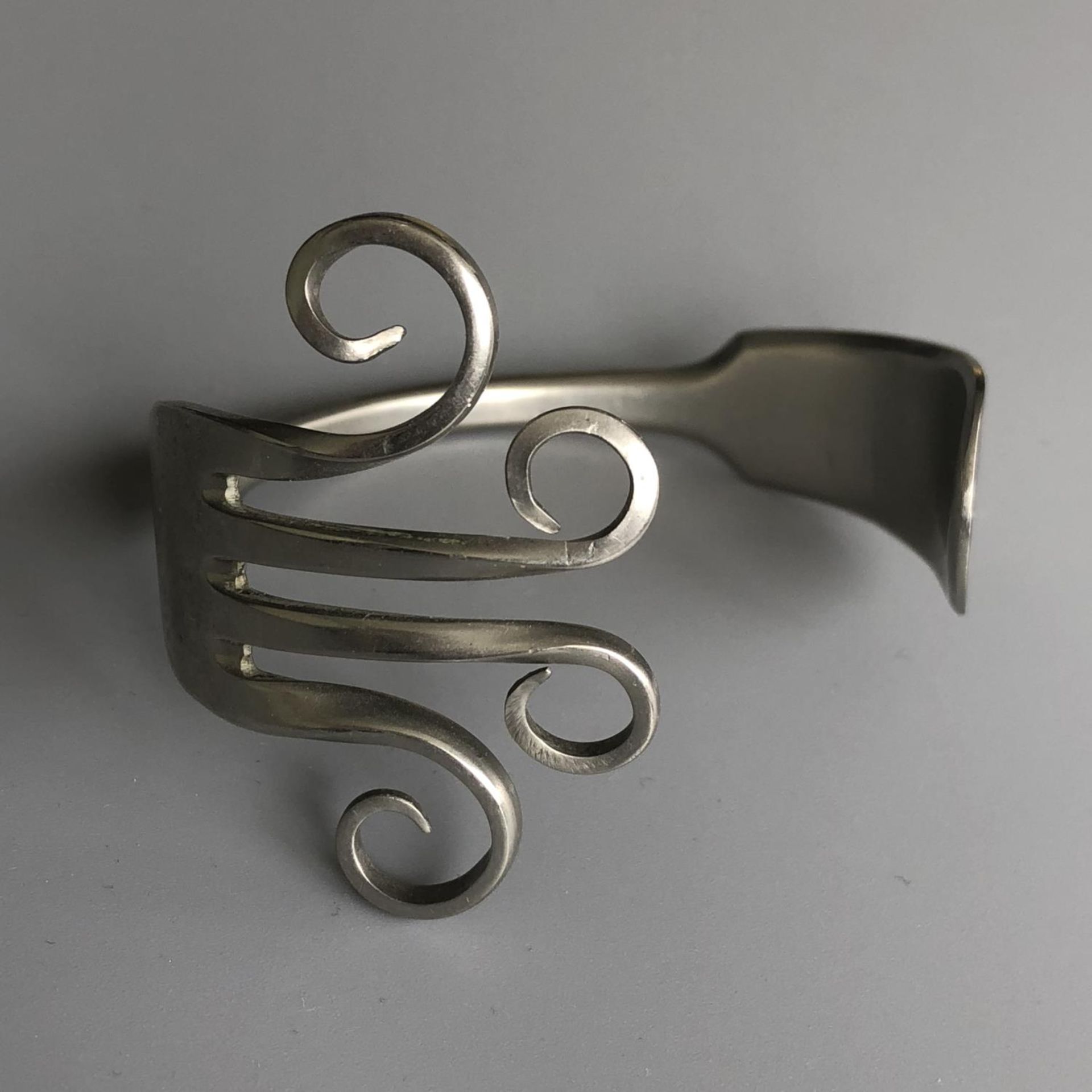 A vintage silver plate fork crafted into a bracelet