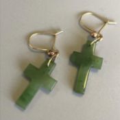 Pair of green hardstone cross earrings