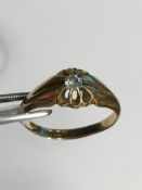 A 18k Yellow Gold and diamond single-stone crossover ring