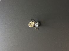 1.51ct diamond set solitaire ring set in platinum. Oval cut light yellow centre stone, VS1