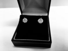 2.00ct Solitaire diamond stud earrings set with brilliant cut diamonds which have been enhanced. H/I