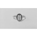 0.95ct diamond set solitaire ring set in platinum. Oval cut diamond, I colour and VS clarity,