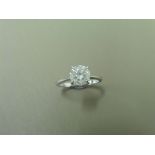 1.24ct diamond solitaire ring set in platinum. Enhanced stone, I colour and I2 clarity. 4 claw