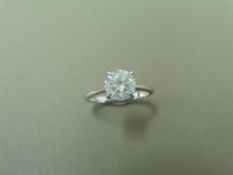 1.24ct diamond solitaire ring set in platinum. Enhanced stone, I colour and I2 clarity. 4 claw