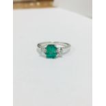 Emerald and diamond trilogy style ring. Rectangular cut emerald ( treated ) 0.70ct with a