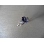 Tanzanite and diamond dress ring set in platinum. Oval cut tanzanite ( heat treated ) 2.40ct