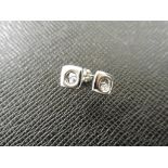 0.10ct diamond earrings set in platinum 950. 2 small brilliant cut diamonds, H colourand si2