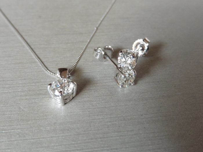 0.25ct / 0.50ct diamond pendant and earring set in platinum. Pendant - 0.25ct brilliant cut diamond,