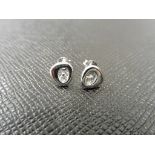 0.12ct diamond earrings set in platinum 950. 2 small brilliant cut diamonds, H/I colourand si2