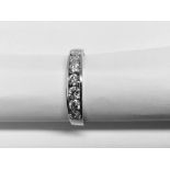 0.70ct diamond band ring set with 7 brilliant cut diamonds in a channel setting. H/I colour and