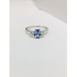 Tanzanite and diamond trilogy ring. 1ct, 7 x 5mm oval tanzanite ( treated ) with a brilliant cut