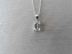 0.61ct emerald cut diamond pendant,vs clarity j colour,platinum setting 1.2gms,9ct curb chain 16Ó,uk