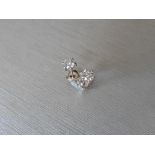 0.75ct Solitaire diamond stud earrings set with brilliant cut diamonds, SI2 clarity and I colour.