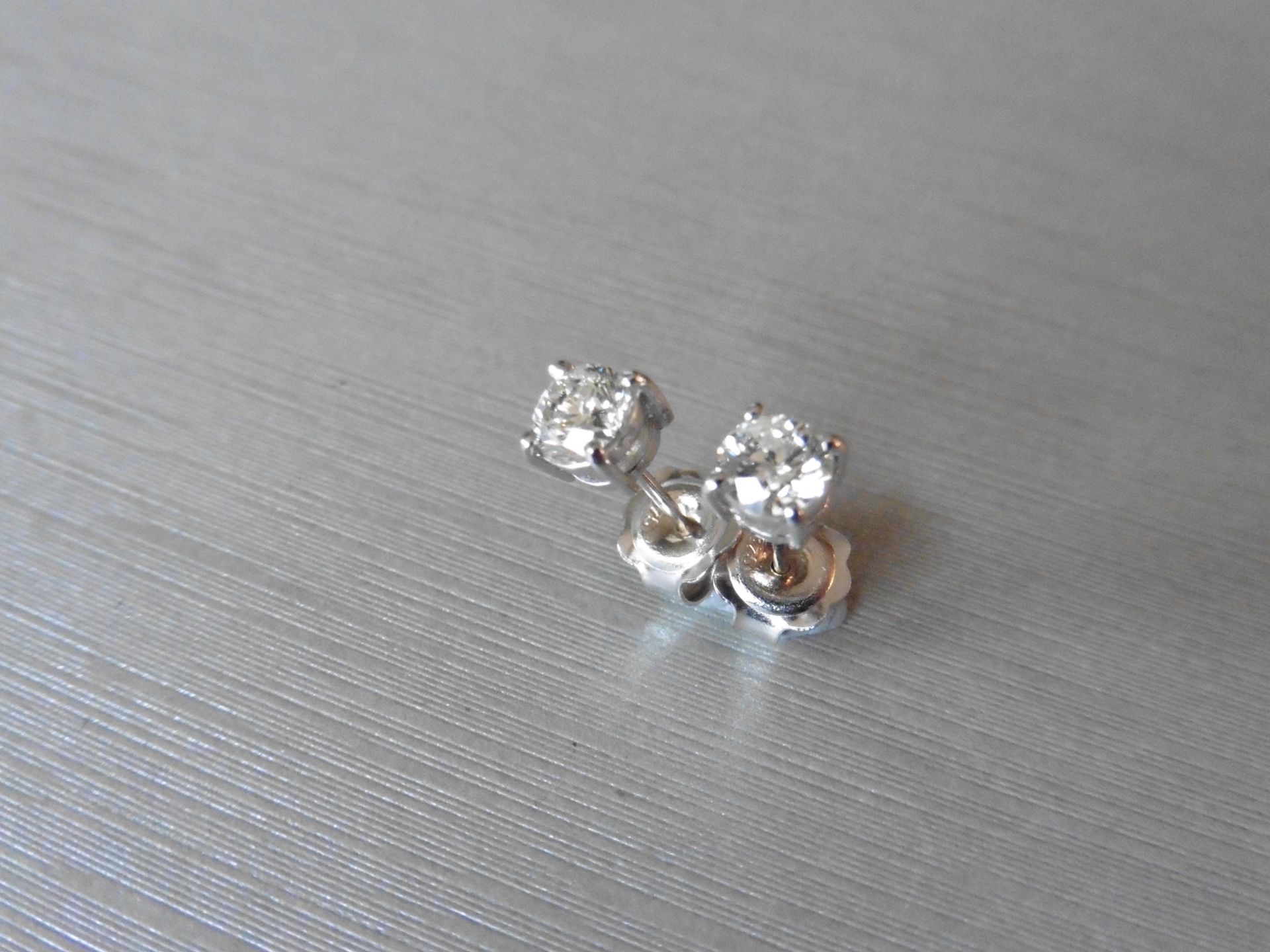 0.50ct Solitaire diamond stud earrings set with brilliant cut diamonds, SI2 clarity and I colour. - Bild 3 aus 3