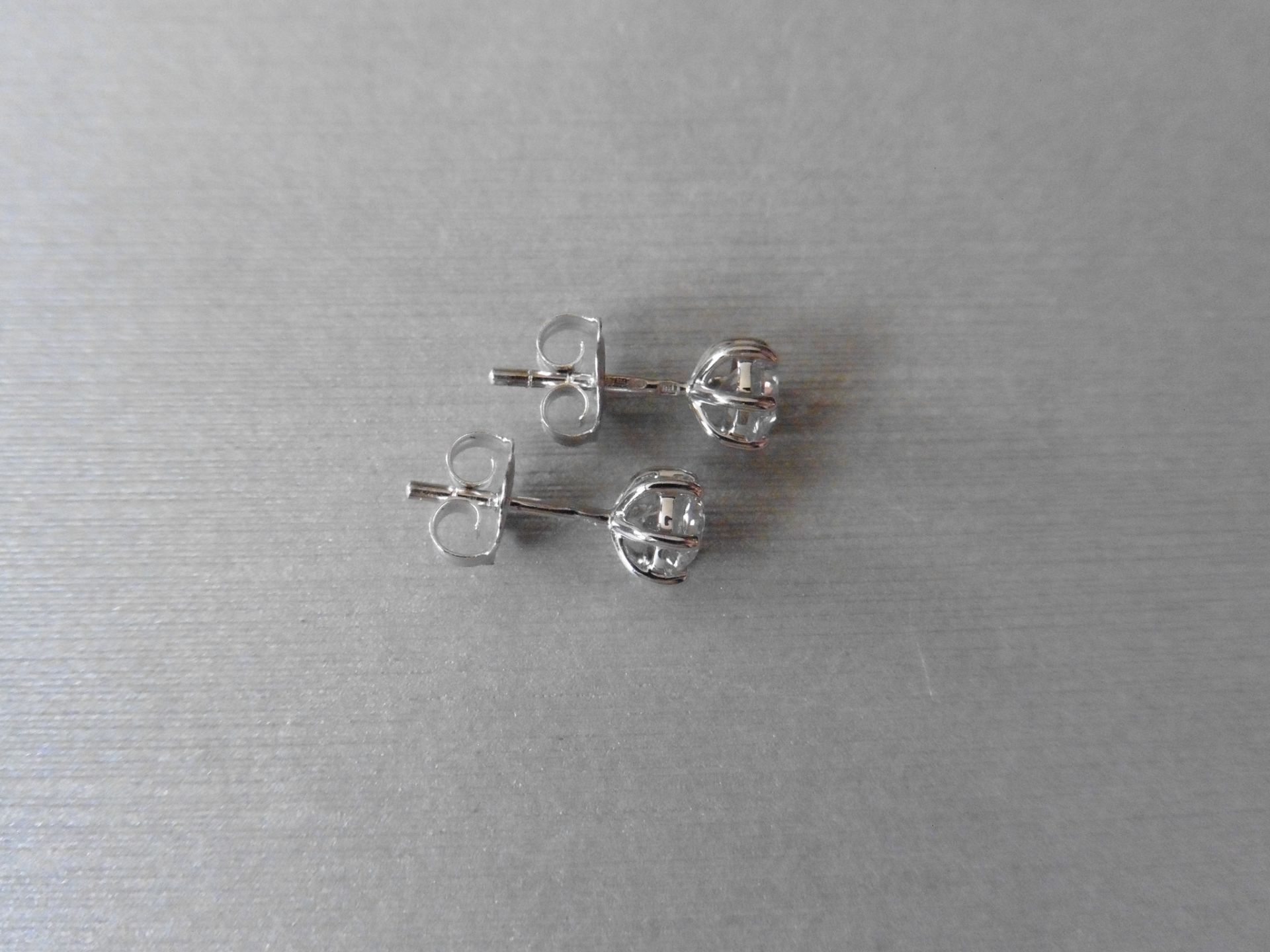 0.75ct Solitaire diamond stud earrings set with brilliant cut diamonds, SI2 clarity and I colour. - Bild 2 aus 2